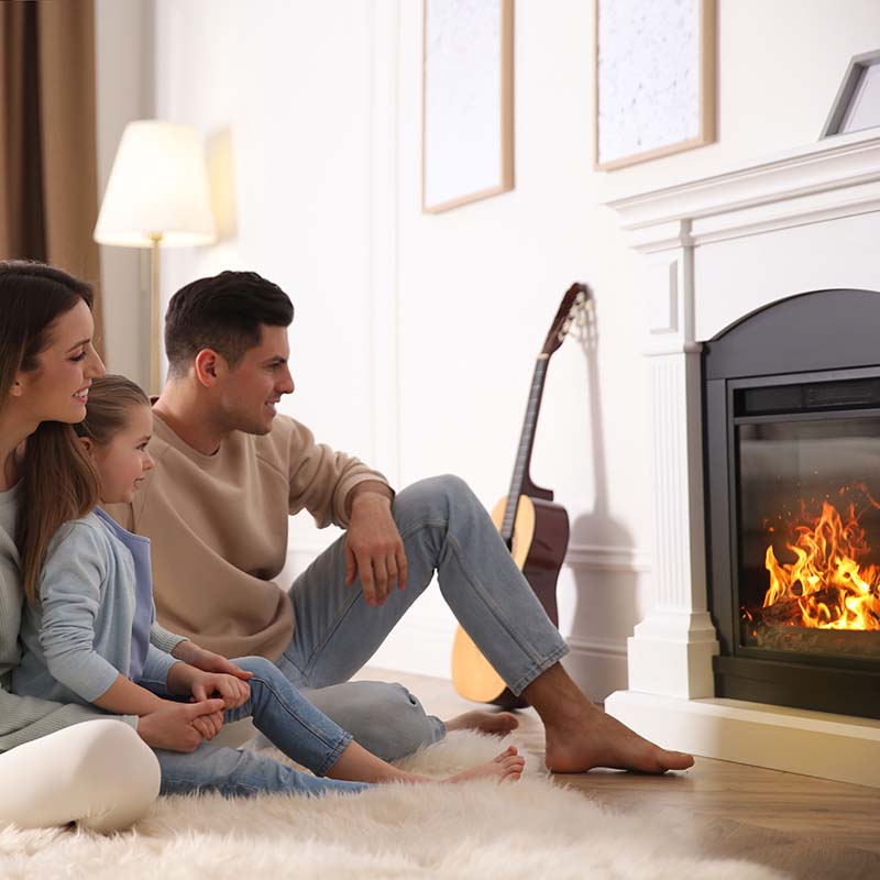 NY Family Sitting in Front of Propane Fireplace